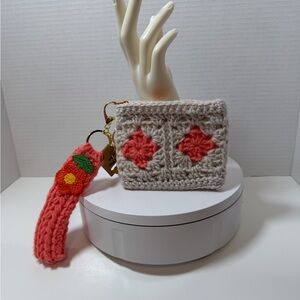 Cream and Orange crochet wristlet with Floral Design